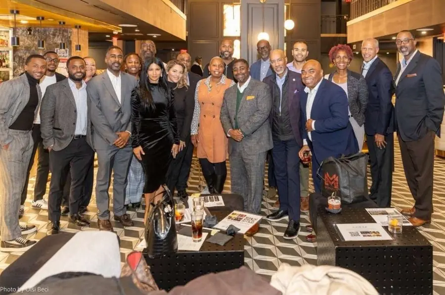 Karina De La Cruz with the C.U.R.E. executive board at a New York industry event